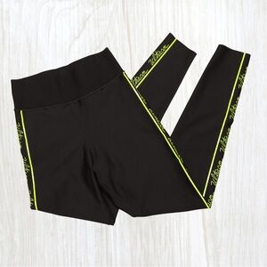 Ultracor Black Leggings with Neon Yellow Trim NWOT Size Medium (runs small!)